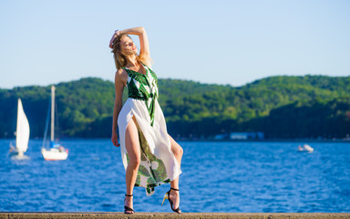 Fototapeta na wymiar Woman in summer long dress against sea
