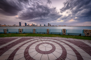 Bahrain Skyline with striking clouds, a view from Al Ghous park, Muharraq