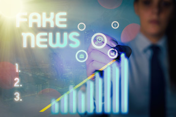 Word writing text Fake News. Business photo showcasing false information publish under the guise of...