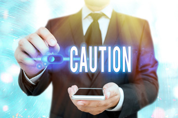 Word writing text Caution. Business photo showcasing Care taken to avoid danger or mistakes Warning...