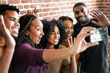 Happy African American taking a selfie - Powered by Adobe