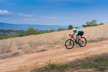 Fototapeta na wymiar Mountain biker cyclist training practice downhill