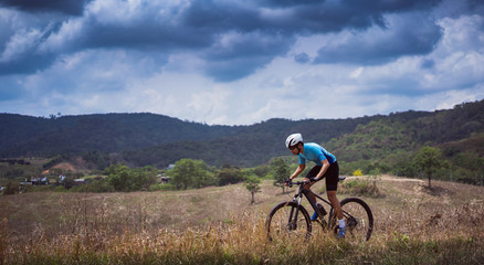 Fototapeta premium Mountain biker cyclists training Mountain trail