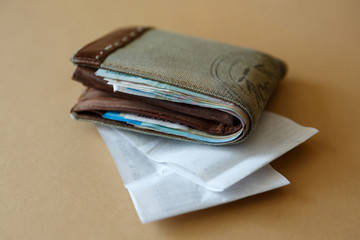 wallet with money and a cashier's check from the store