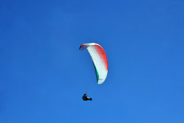 paragliding in the blue sky