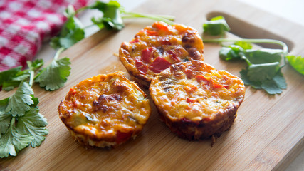 Salty muffins with egg and vegetables