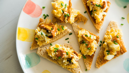 Cod with scrambled eggs and mushrooms