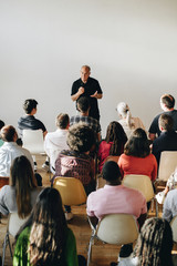 Senior man talking in a seminar