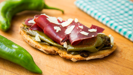Toast with iberico ham and fried paprika