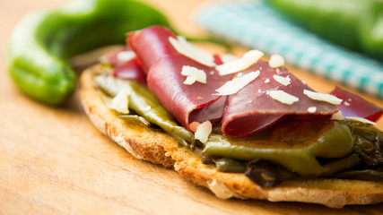 Toast with iberico ham and fried paprika