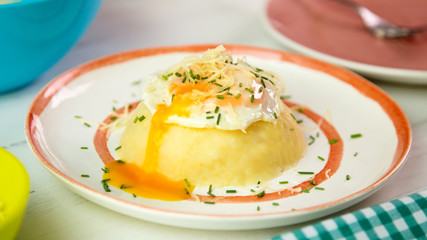 Smashed potato with fried egg on the top