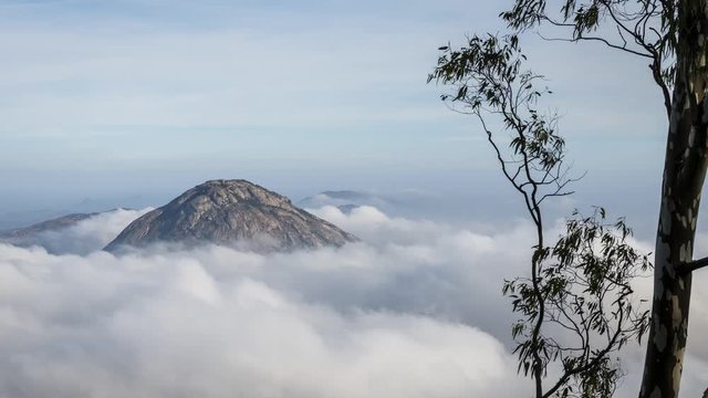 4k Timelapse of fog clouds at Nandi Hills, a famous hill station and a tourist spot in Bengaluru or Bangalore, Karnataka, India
