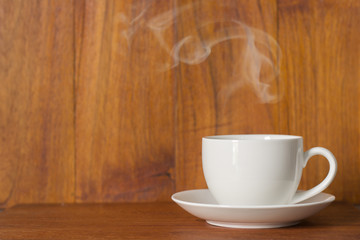 Coffee espresso on wood table nature background in garden,warm tone,rustic wood,