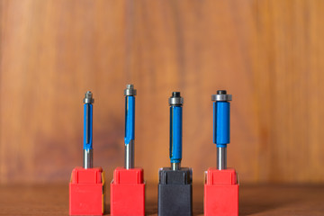 Electric powered router on wood background,front view red speed variable power small plunge router...