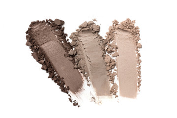Smears of gray eyeshadow on white