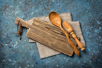 Blank vintage wooden cutting board with spoon and scoop