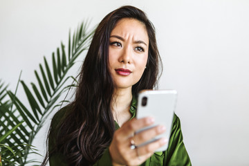 Confused woman reading a text