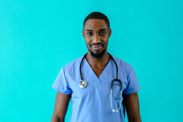 Portrait of a friendly male doctor or nurse wearing blue scrubs uniform and stethoscope, isolated...