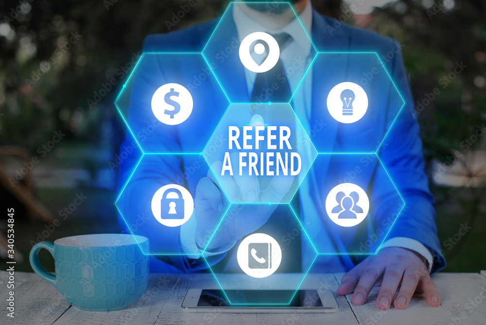 Aufkleber writing note showing refer a friend. business concept for direct someone to another or send him some