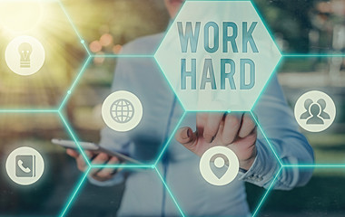 Writing note showing Work Hard. Business concept for Laboring that puts effort into doing and...