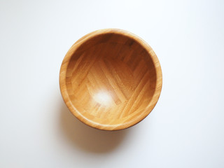 Isolated wooden bowl on a white background