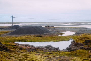industrial field gravel mining and mountains of stones in a quarry in Iceland