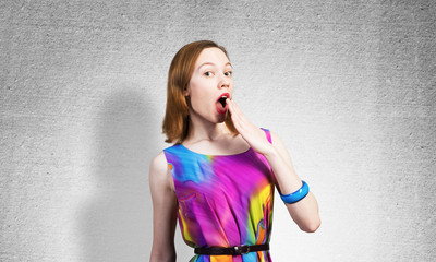 Fototapeta premium Surprised young female model with red hair