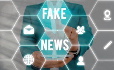 Word writing text Fake News. Business photo showcasing false information publish under the guise of...