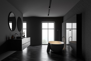 Dark grey bathroom with tub and sink