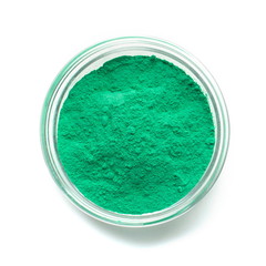 Mint color powder paint in glass bowl, close up