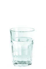 Pure clear water in a glass glass and glass jug stands on a white background