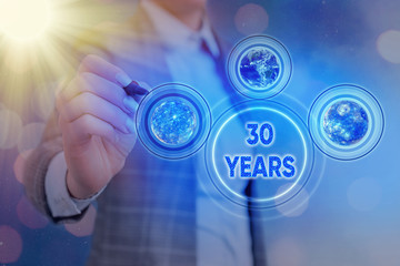 Word writing text 30 Years. Business photo showcasing Remembering or honoring special day for being 30 years in existence Elements of this image furnished by NASA