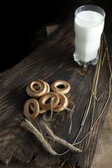 Breakfast with fresh milk and bagels. Milk and Bagels. Spikelets of dry wheat.