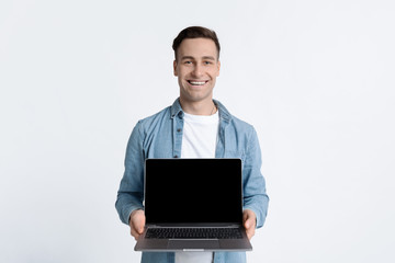 Victory online concept. Happy man with laptop