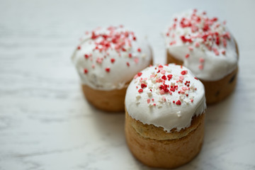 Three Easter cakes on a white table