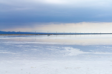 Electric poles in Chaka Salt Lake, China.Caka Salt Lake in Qinghai, China.Chaka Salt Lake in Qinghai, China. Qinghai's Chaka Salt Lake is full of fantasy scenery