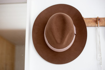Brown Old fashioned trilby hat on a hat rack