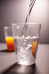 Pouring water into the glass
