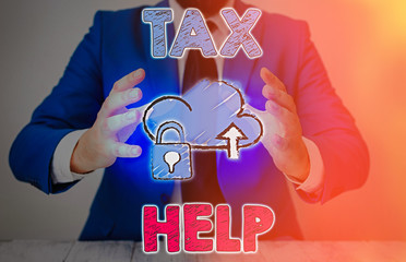 Conceptual hand writing showing Tax Help. Concept meaning Assistance from the compulsory...