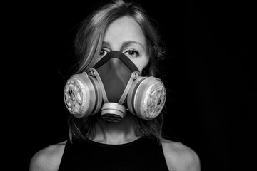 Conceptual photo woman eyes of young woman in respirator. Black white emotional dramatic portrait....