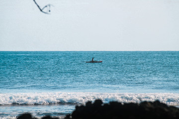 Fisherman on canoe