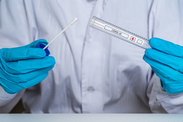 Doctor holds in his hands an express test for coronavirus COVID-19