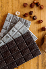 tiled chocolates and different varieties and nuts