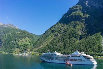 Cruise ship in Geiranger fjord in Norway