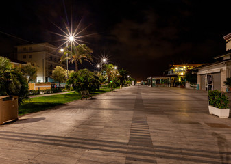 A deserted promenade in Lido di Camaiore, a seaside resort liked by Italians. Tuscany, Italy