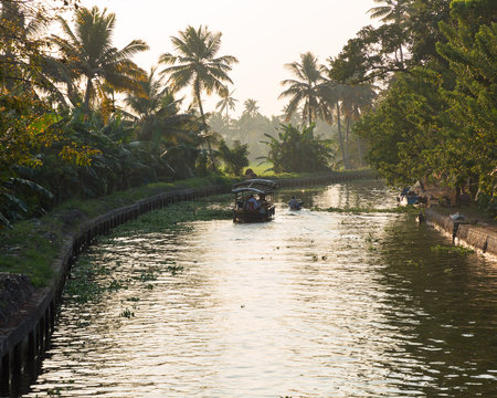 Boats in canal in the backwaters of alleppey kerala
