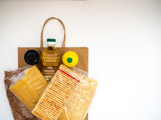 Craft package with food supplies on white background, top view with copy space