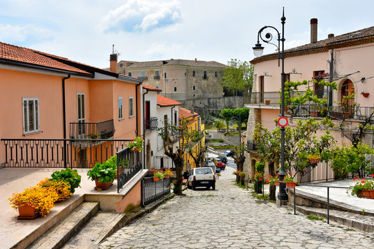 Fototapeta A narrow street between the old houses of Gesualdo, a village in the province of Avellino