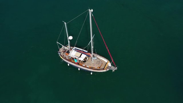 Old Sailboat sailing on the Blue Sea - Aerial top down View
