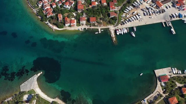 Old Beautiful Mediterranean Harbour Village Veli Iž on Island Iž in Adriatic Sea, Croatia - Aerial top down Drone View